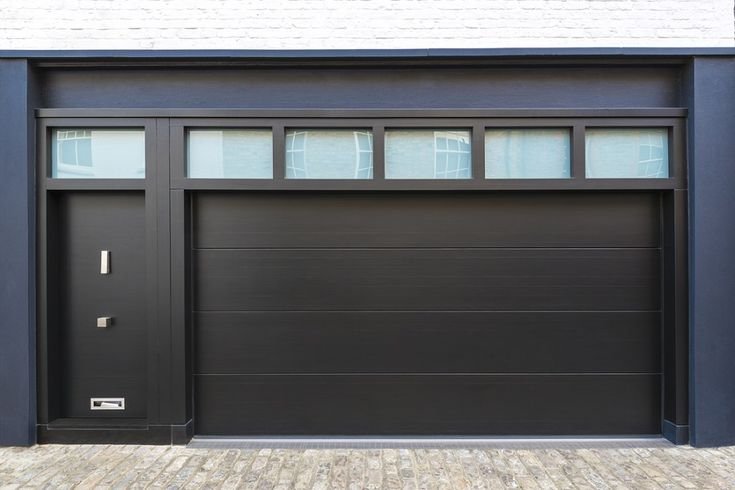 Professional licensed garage door technician performing repair in Columbus, OH