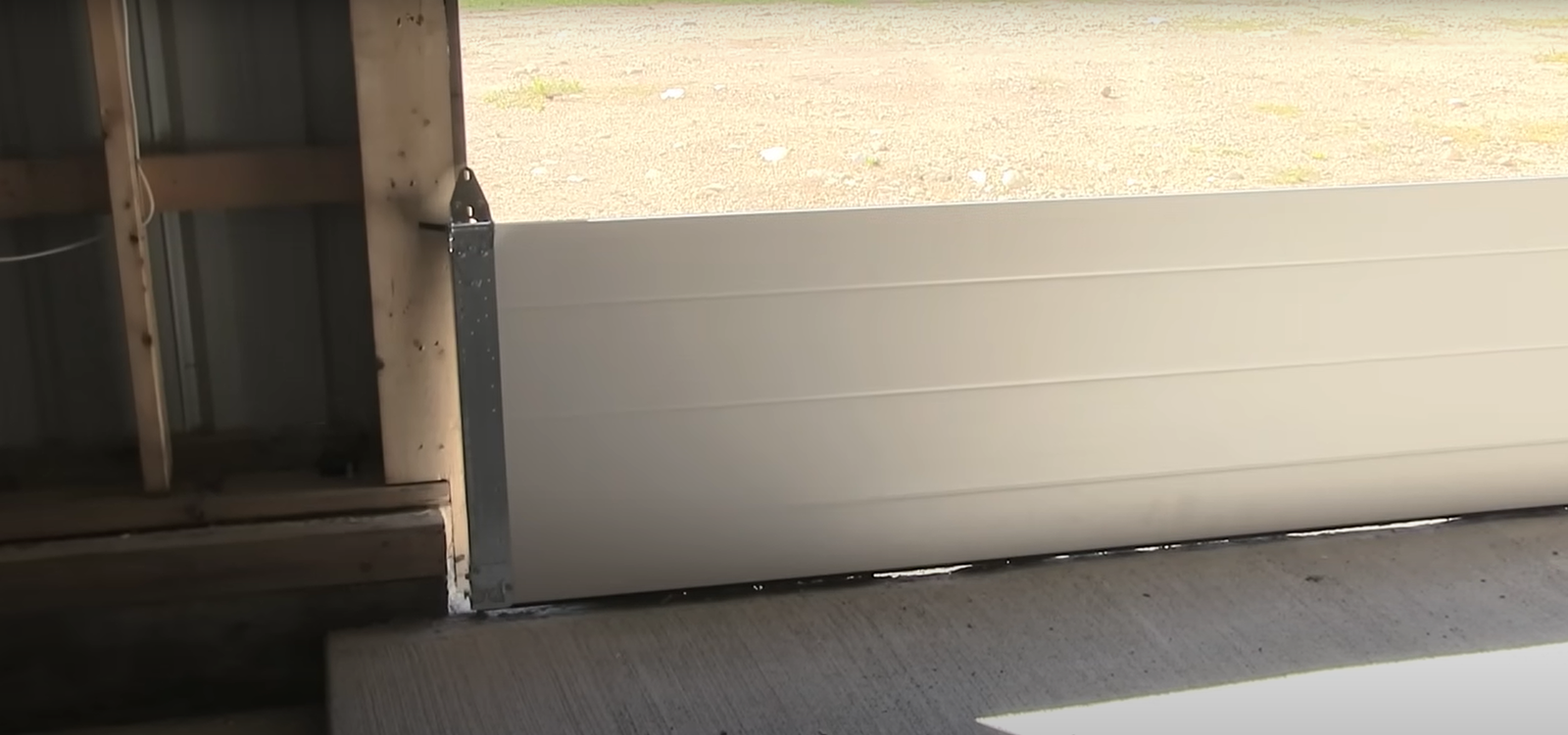 A professional technician performing a garage door installation, showcasing the step-by-step process for Expert Garage Door Repair.