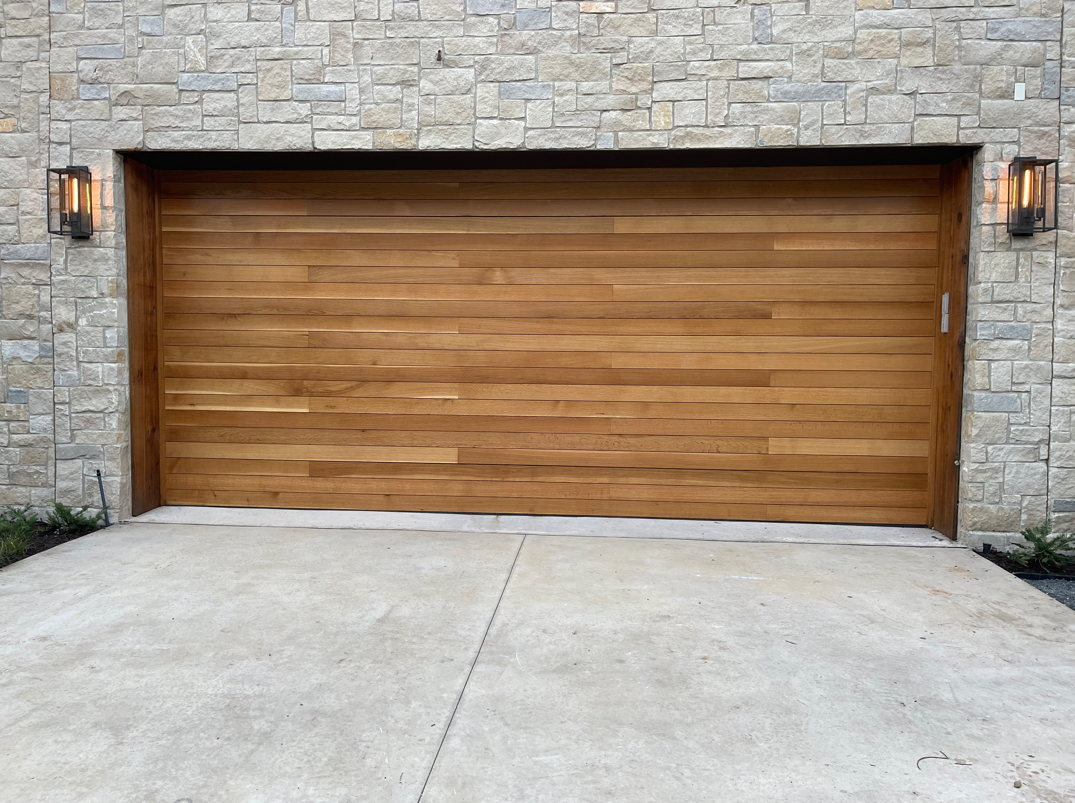 Professional technician providing local garage door repair services in a residential area, showcasing expert maintenance and reliability.