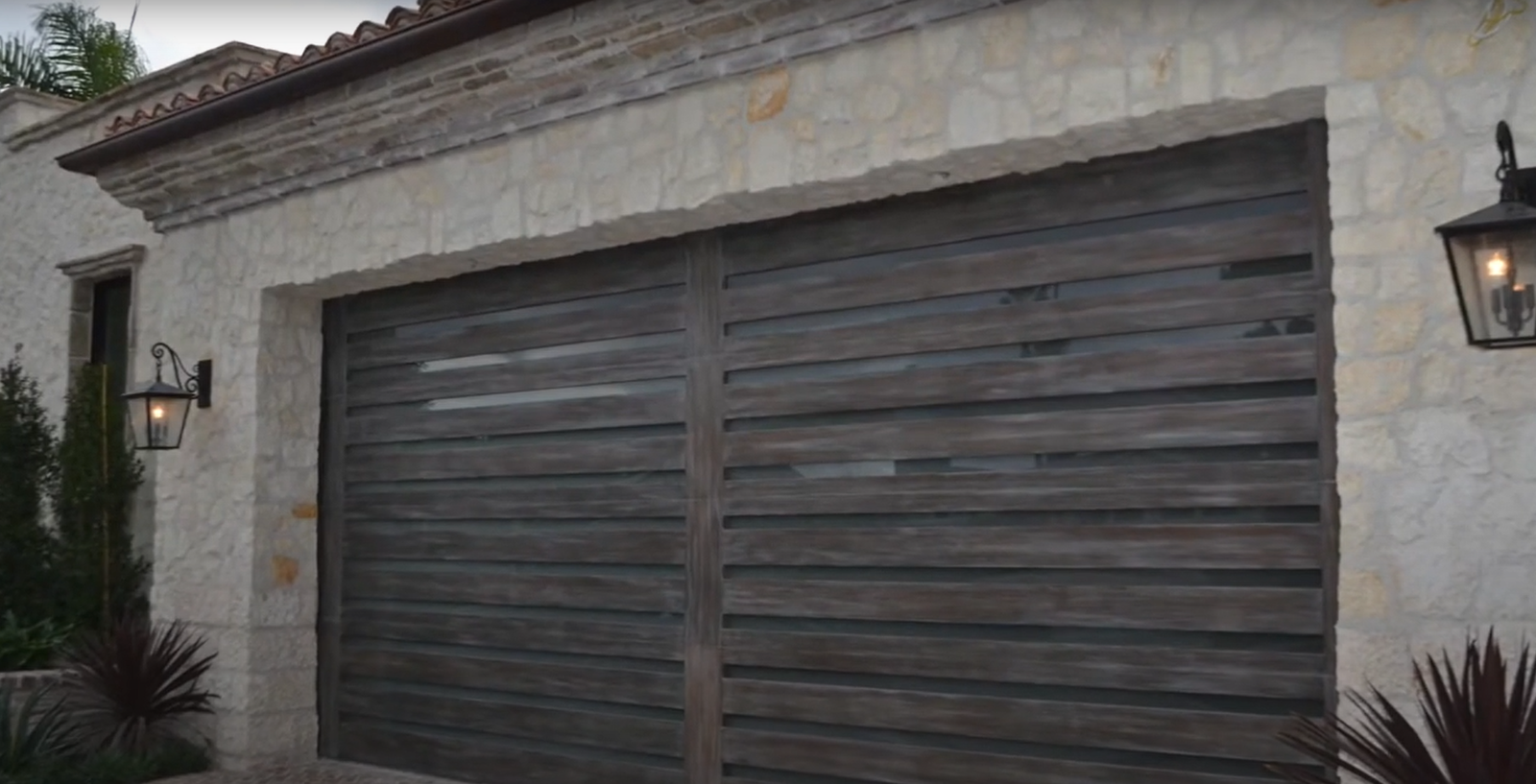 Professional technician performing a garage door section replacement with precision and expert tools, highlighting detailed removal and installation process.