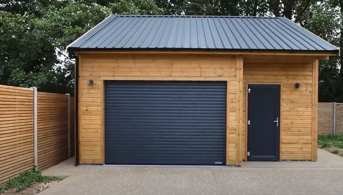 Professional technician in branded uniform performing local garage door repair with advanced tools, ensuring security and convenience for the homeowner.