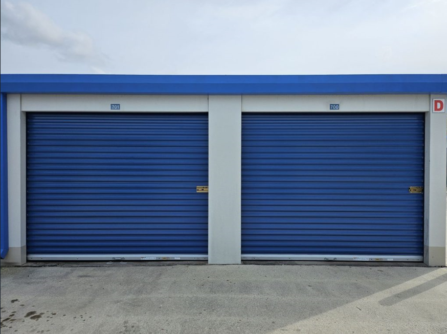 team of technicians expertly performing a commercial garage door repair service, showcasing professionalism and expertise.